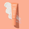 Bottle of Urban Skin RX Vitamin C + E Bright Glowing Moisturizer with a swatch of product on a pale pink background 