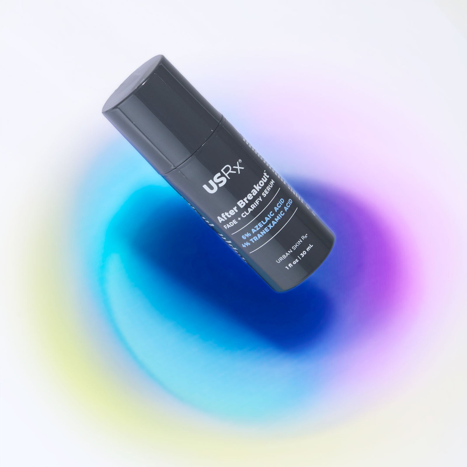 Bottle of Urban Skin RX After Breakout Treatment Fade & Clarify Serum against colorful blue background