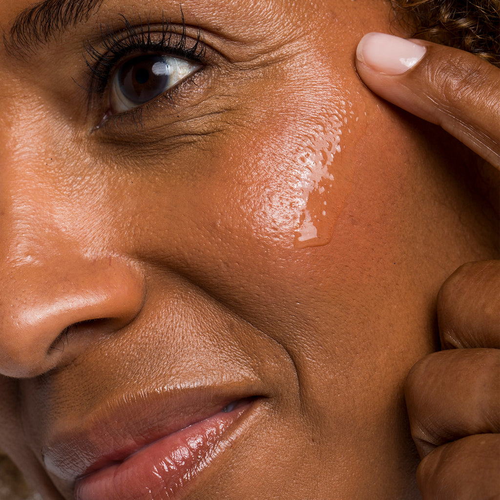 Woman applying Urban Skin RX Hydrafirm Brightening Serum to her face
