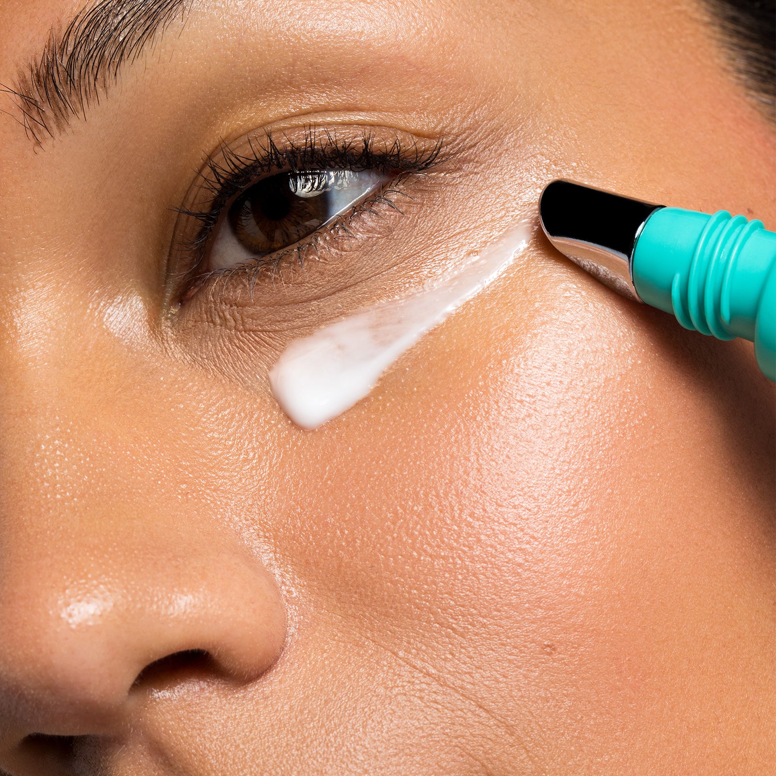 Woman applying USRX Even Tone Barrier Repair Cream to her face