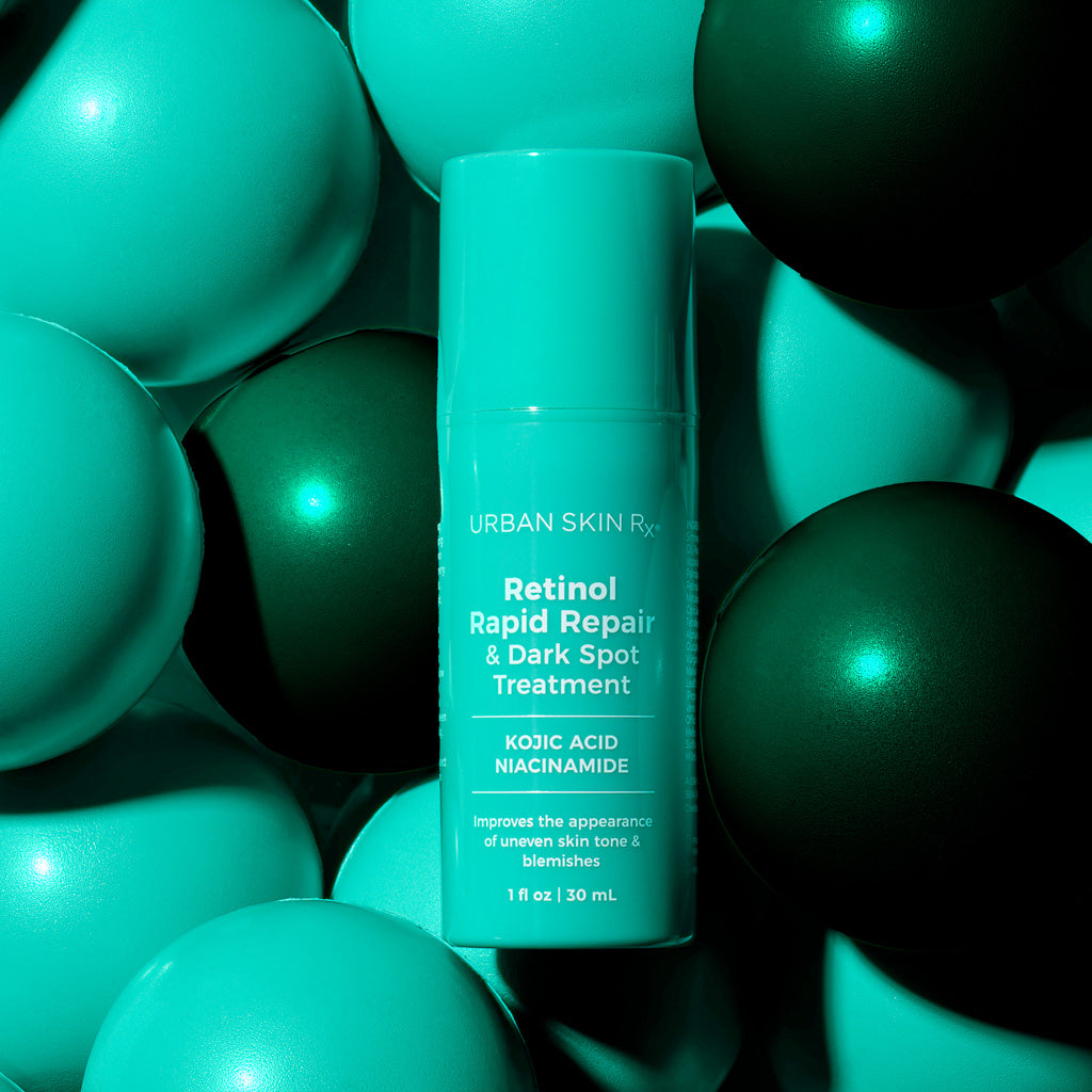 1 fluid ounce bottle of Urban Skin Rx Retinol Rapid Repair Dark Spot Treatment set against colorful light blue and green background