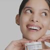 Woman using USRX Clean Skin Cleansing Bar treatment for clarifying skin