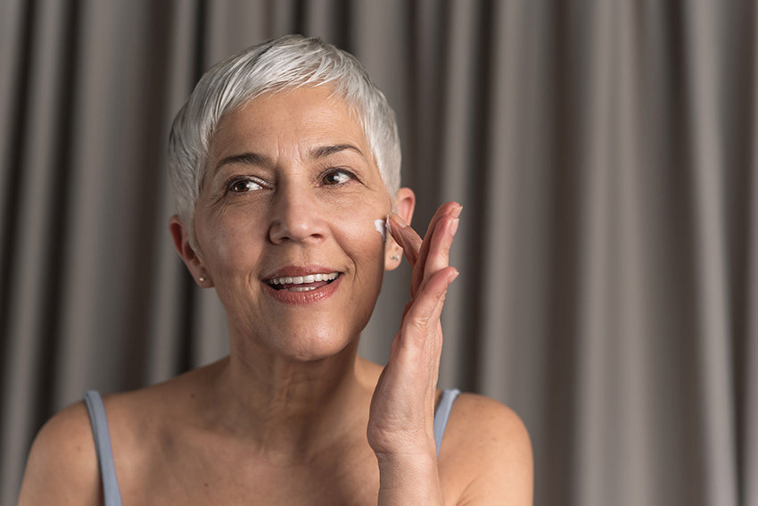 person happily looking in the mirror
