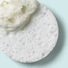 Round sponge applicator with a sample of Urban Skin RX Clear Skin Cleansing bar product on it