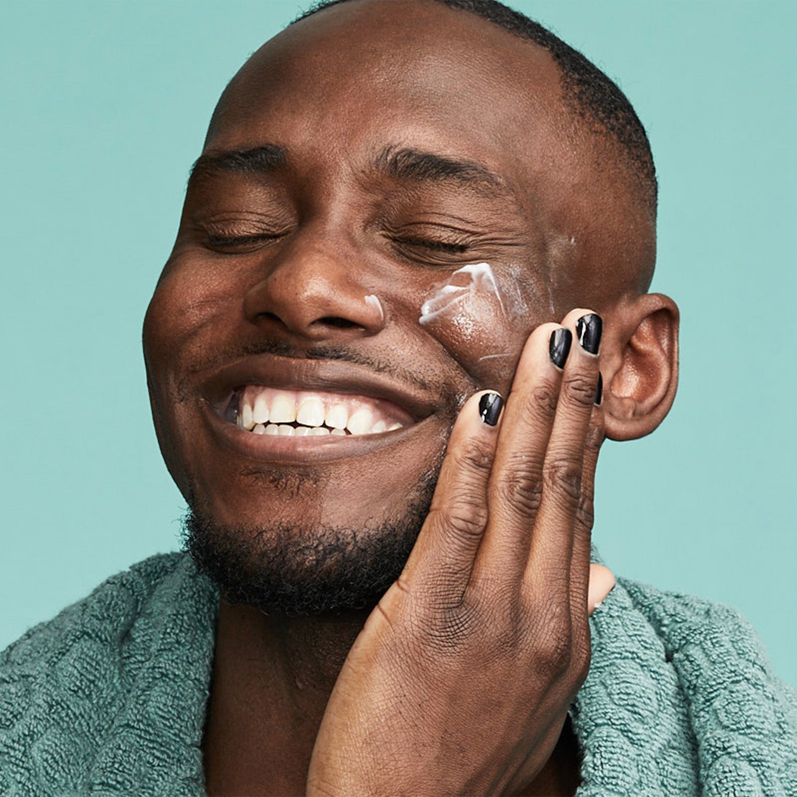 Man applying Urban Skin RX Even Tone Soothing Moisturizer to his face