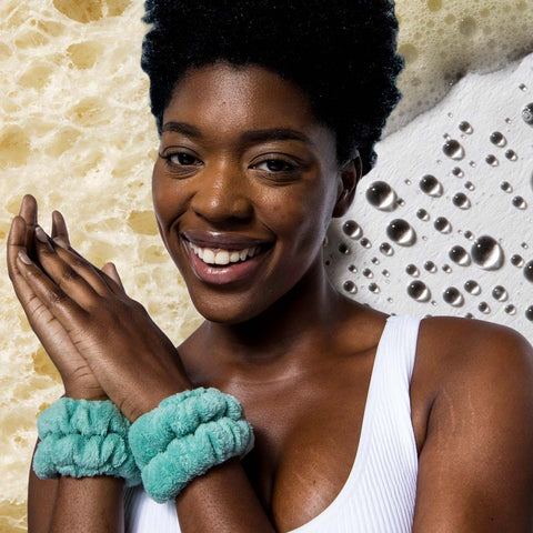 Woman smiling wearing water cuffs on wrists